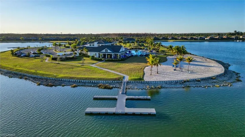 Aerial view of amenities area - floating docks, beach, clubhouse, pool and more