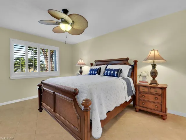 Tiled bedroom with ceiling fan