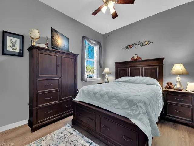 Bedroom with ceiling fan and light hardwood / wood-style flooring