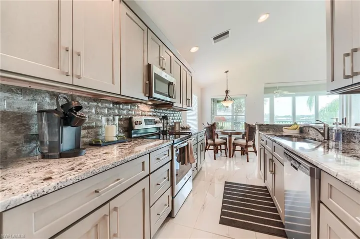 Kitchen featuring plenty of natural light, visible vents, a sink, and appliances with stainless steel finishes
