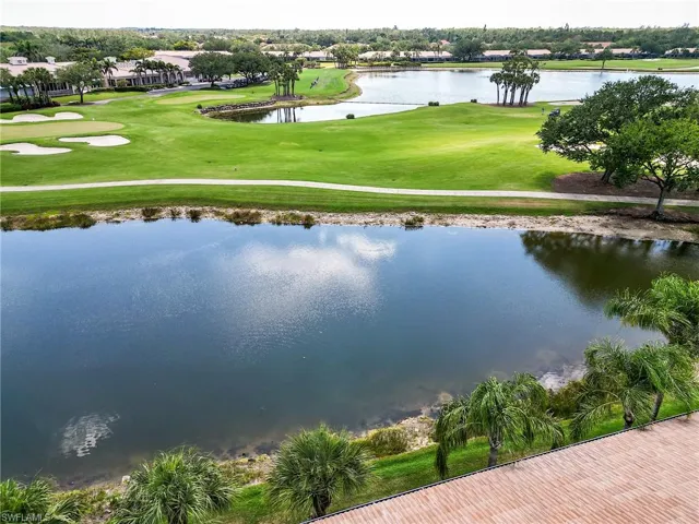 Bird's eye view with view of golf course and a water view