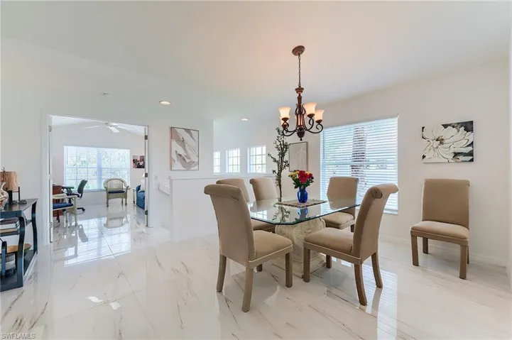 Dining area with baseboards, recessed lighting, and a healthy amount of sunlight