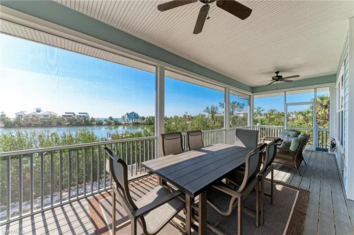 Sunroom with a water view