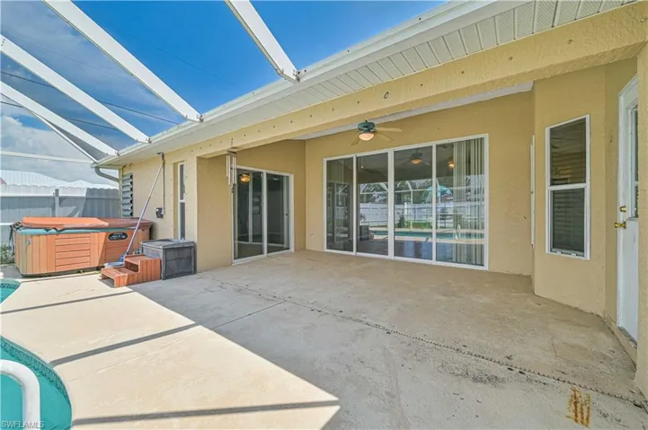 View of patio / terrace featuring a hot tub and ceiling fan