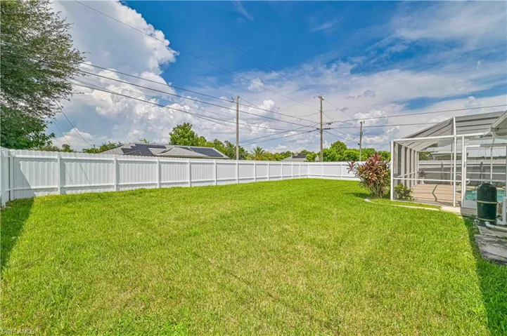 View of yard featuring a lanai