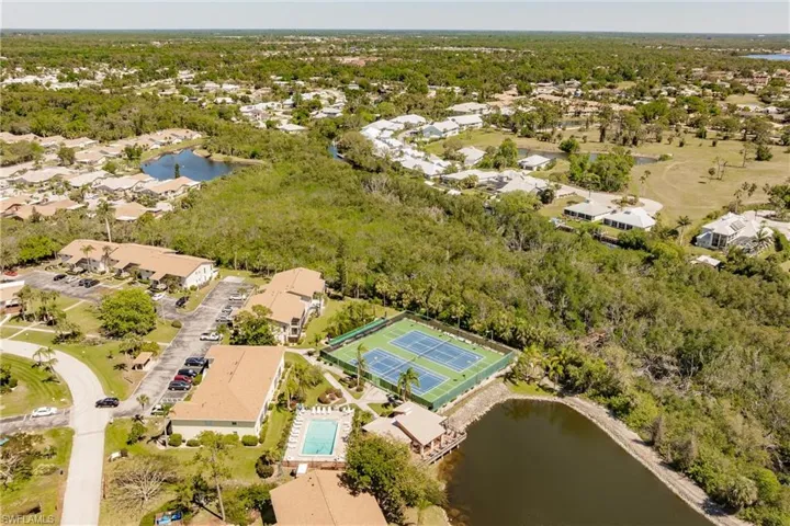 Drone / aerial view featuring a water view and a residential view