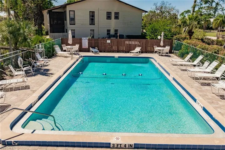 your second community Pool with a patio and fence