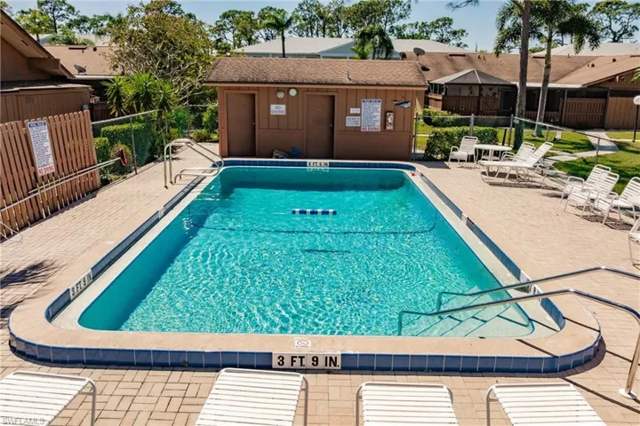one of the Community pool featuring a patio only a few steps from your front door. fence