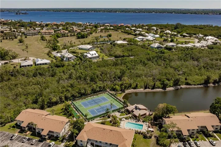 Drone / aerial view with a water view and a residential view