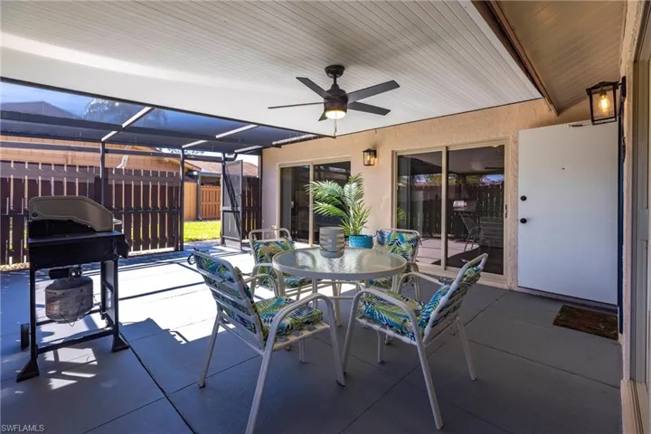 View of patio with  outdoor screened enclosure to enjoy the Florida weather.