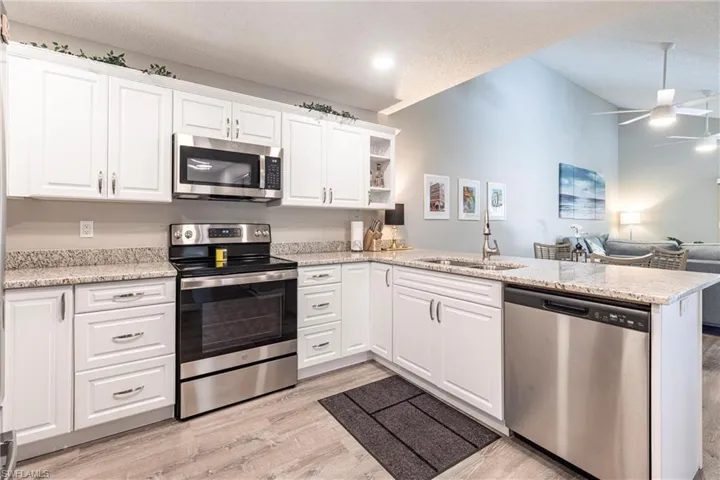 Your all new kitchen show the home open concept featuring a peninsula.