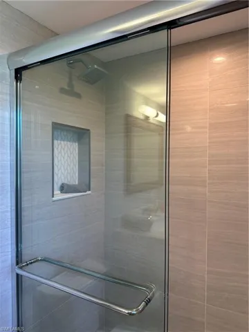 Full bath featuring a stall shower