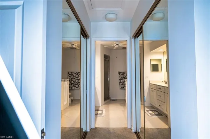 Corridor with his and hers closets