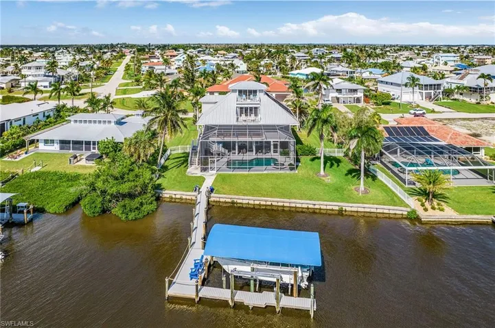 Aerial perspective of suburban area with a large body of water