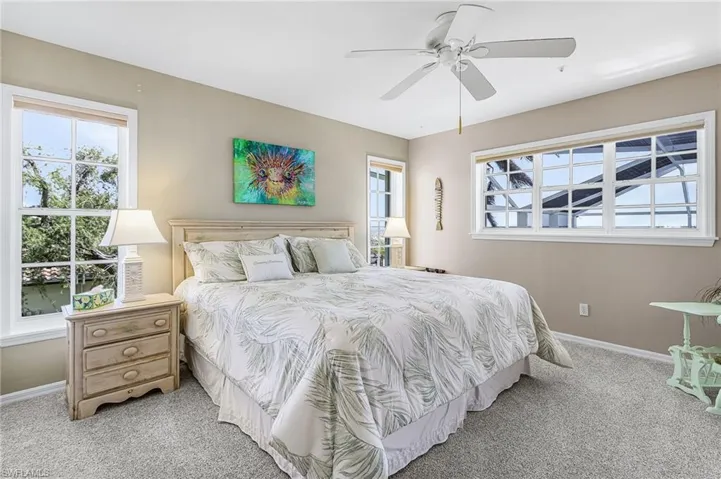 Bedroom featuring carpet floors and ceiling fan