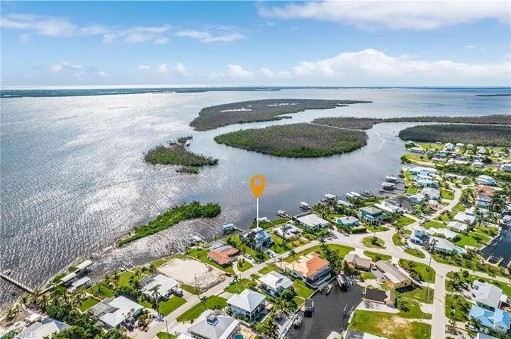 Aerial overview of property's location with nearby suburban area and a large body of water