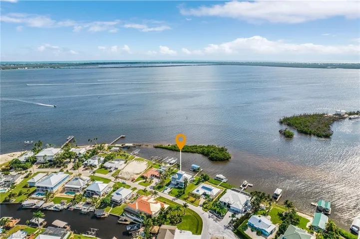 View of property location with nearby suburban area and a large body of water