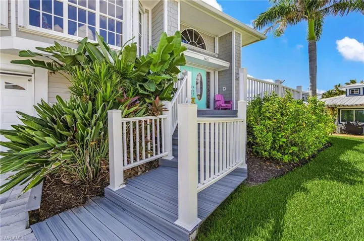 View of home's exterior featuring a garage and a yard