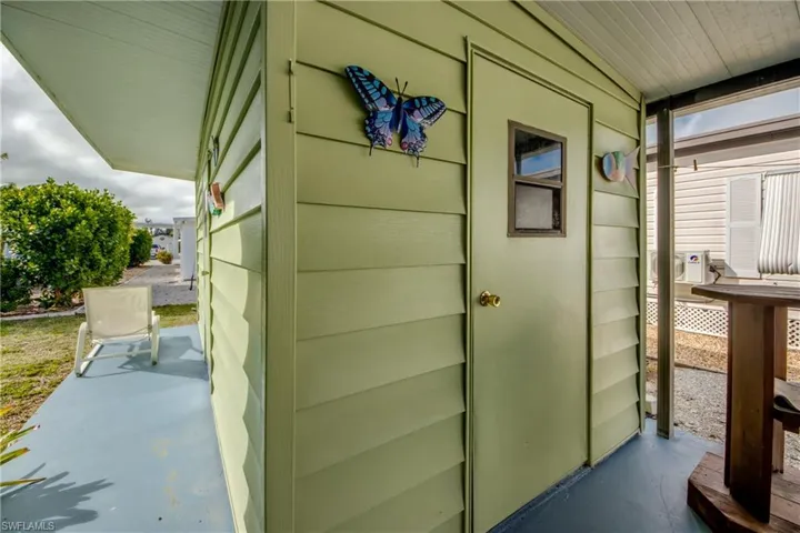 Doorway to property with a patio