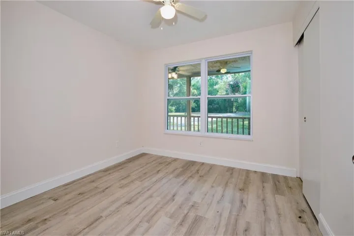 Unfurnished room with baseboards and light wood finished floors