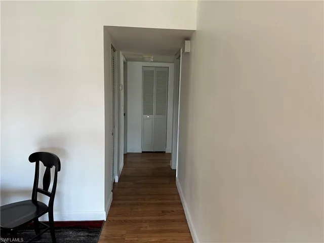 Hall featuring dark hardwood / wood-style flooring