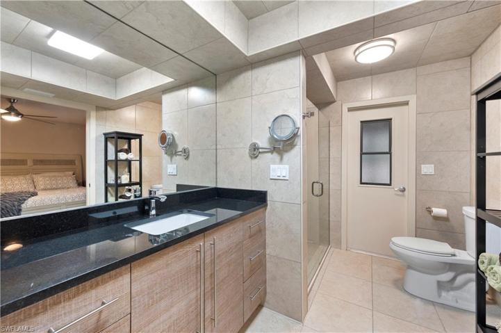 Updated Owner's Bath with access to pool and lanai