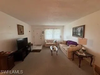 Living room with view to entrance door