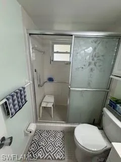 Bathroom featuring vanity, tile patterned floors, and a stall shower