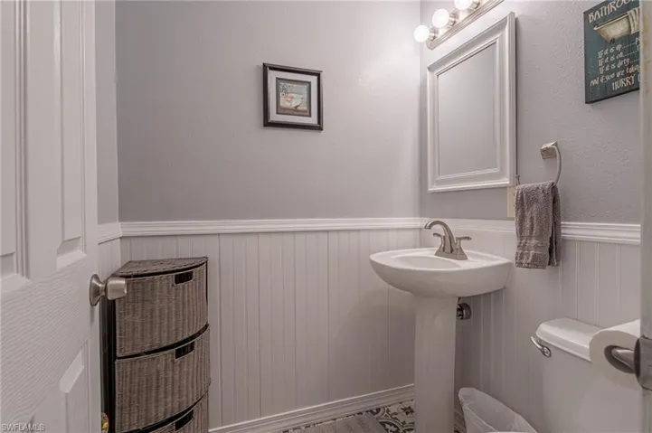 1/2 Bath as you come in from the garage