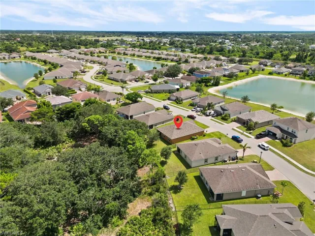 Aerial view of residential area featuring a large body of water