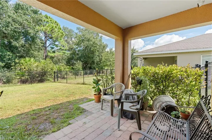Fenced backyard with a patio area