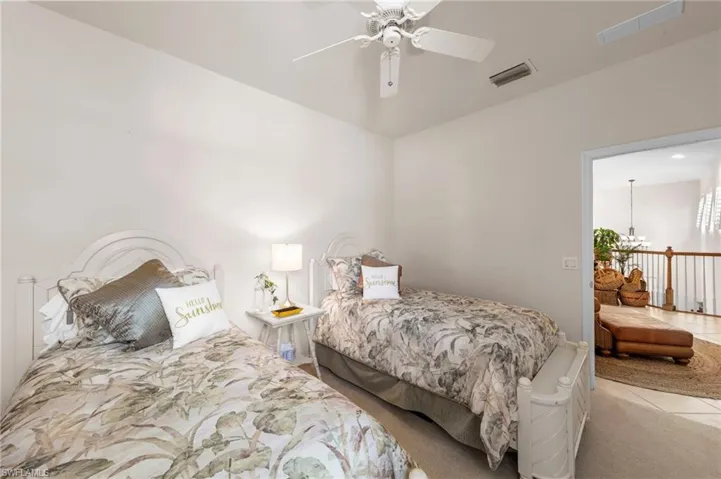 Sunroom featuring a textured wall and tile patterned flooring