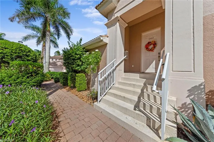View of exterior entry featuring stucco siding