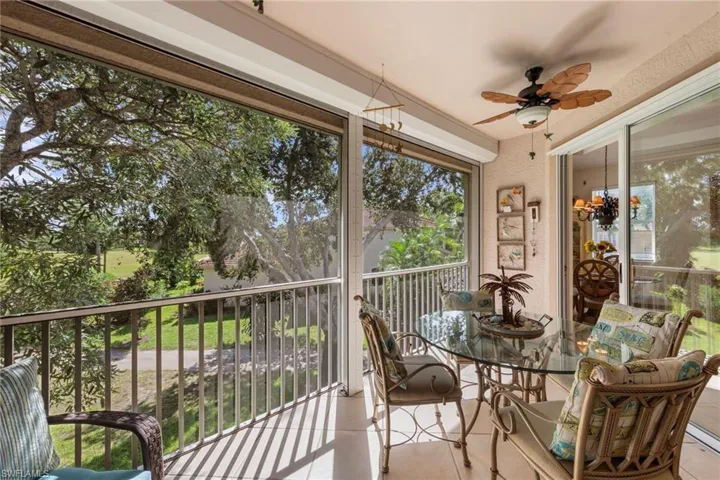 Sunroom with healthy amount of natural light and tile patterned floors