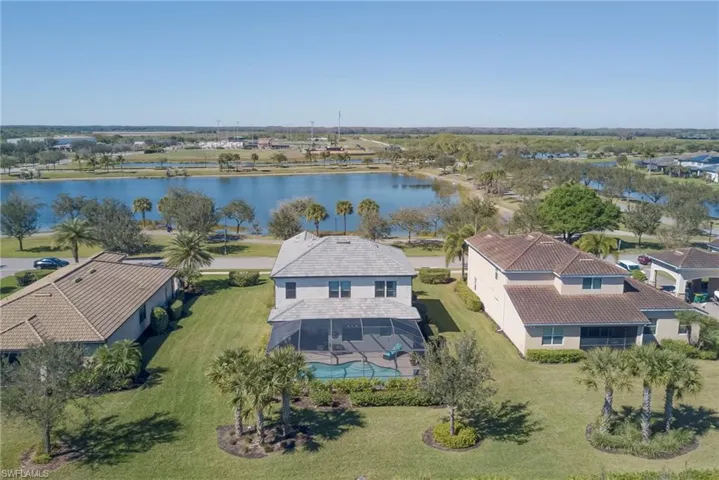 Aerial perspective of area with lake across street