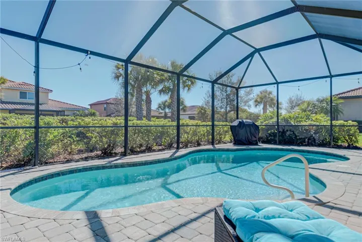 Swimming pool with lanai enclosure