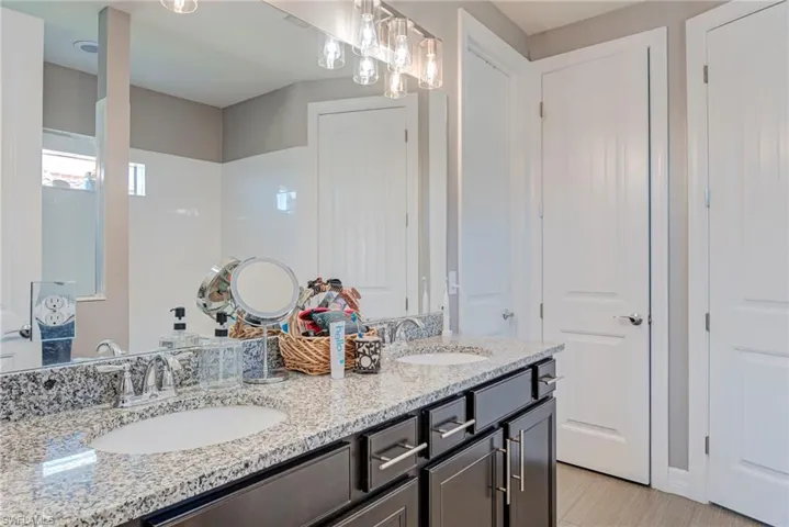 Full bath featuring double vanity
