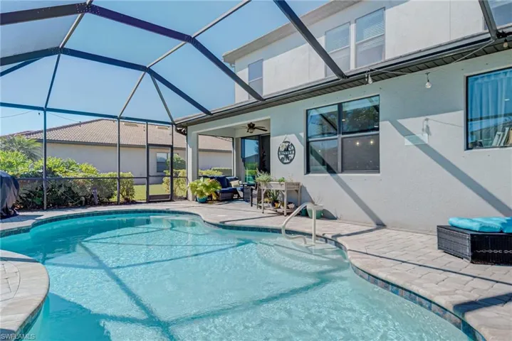 Outdoor pool with a lanai enclosure
