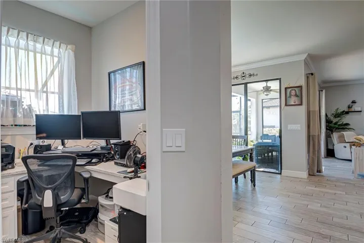 Home office with plank tile floors
