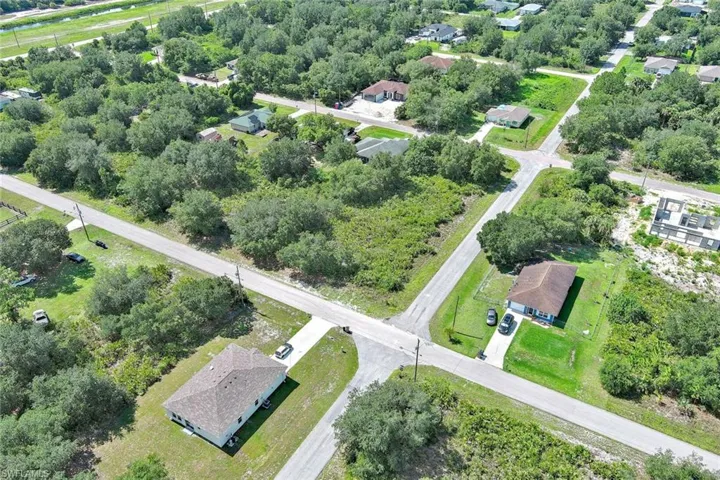 Aerial overview of property's location featuring nearby suburban area