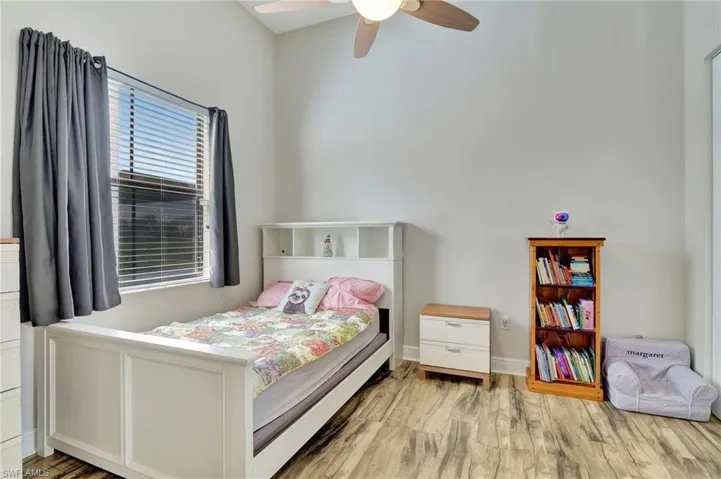 Bedroom #3 featuring light hardwood / wood-style floors and ceiling fan