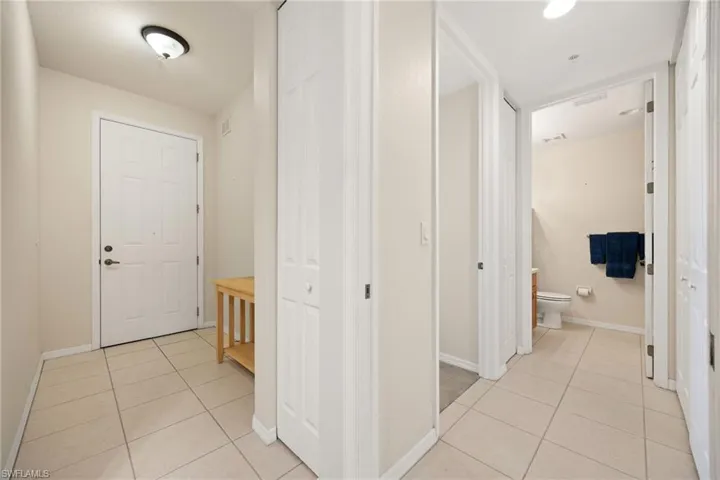 Front Entryway door to outside on the left, hallway to guest bedroom and bath on the right
