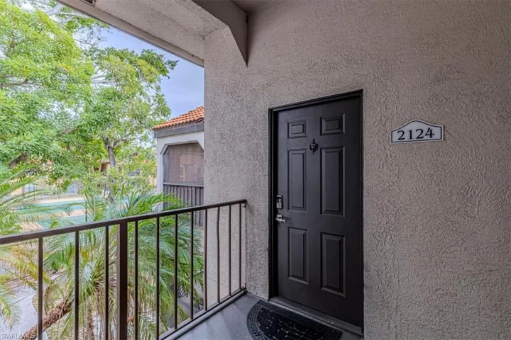 View of exterior entry with stucco siding