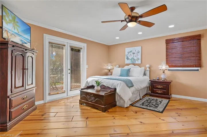 Bedroom featuring crown molding, access to outside, ceiling fan, and light hardwood / wood-style floors
