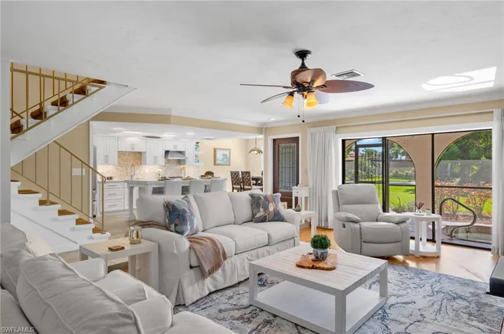 Living room featuring light hardwood / wood-style flooring and ceiling fan