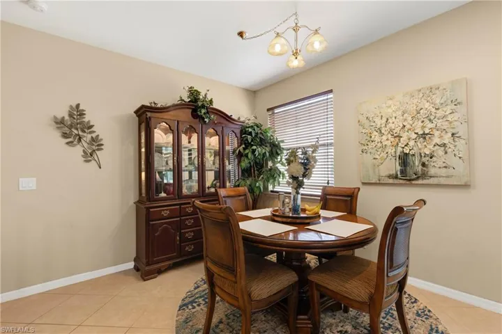 Dining room featuring a chandelier and light tile patterned flooring