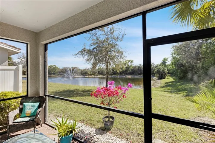 Unfurnished sunroom featuring a water view