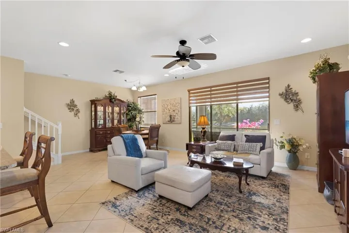 Tiled living room with ceiling fan