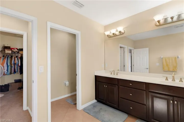 Bathroom featuring vanity and tile patterned flooring