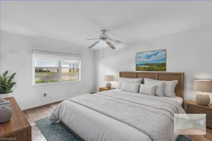 Bedroom with ceiling fan and light hardwood / wood-style flooring